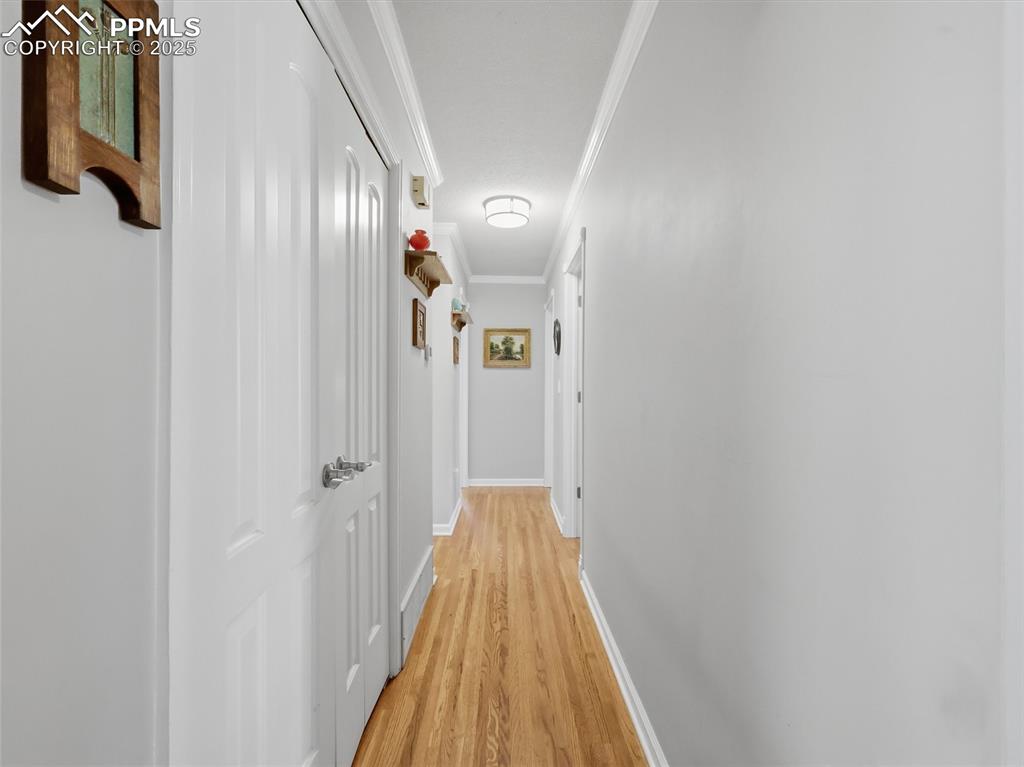 Image 14 of 47: Hall way from Kitchen to the bedrooms and bathroom