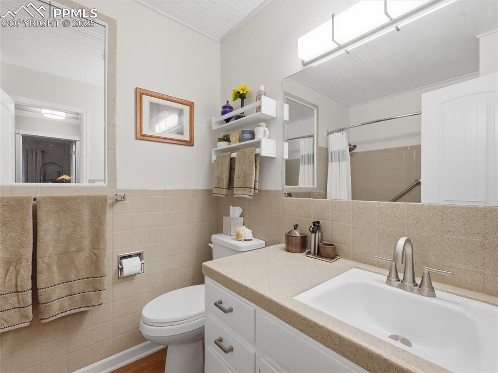 Image 15 of 47: Main floor hall bathroom