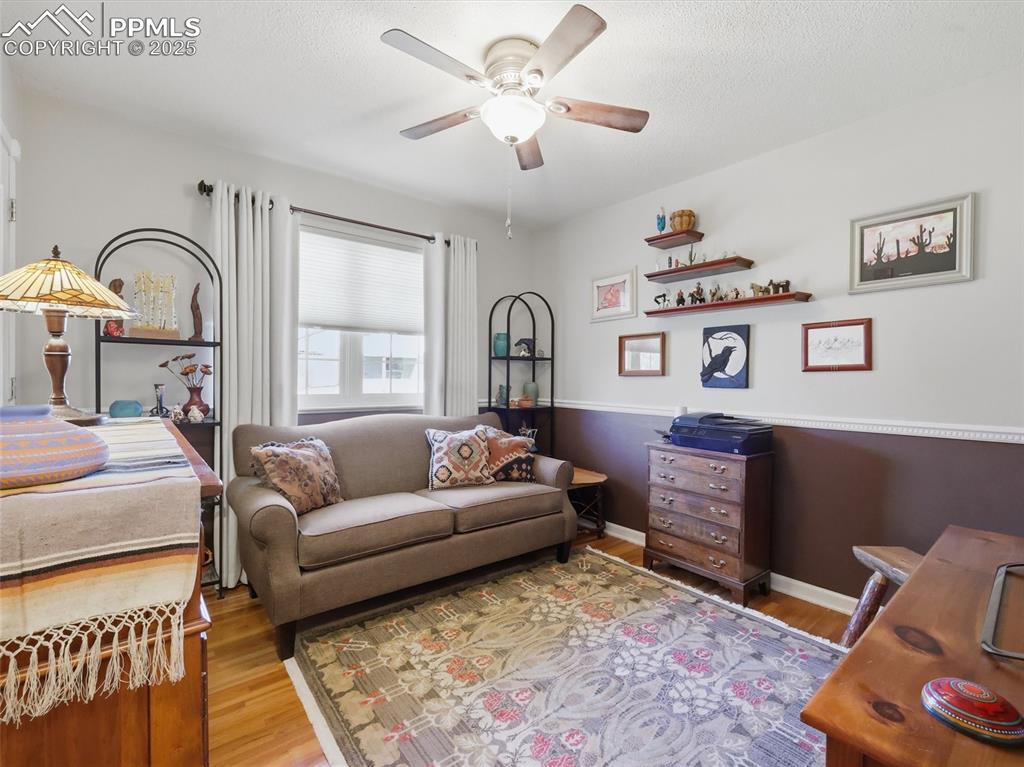 Image 16 of 47: Main floor bedroom set up as a den