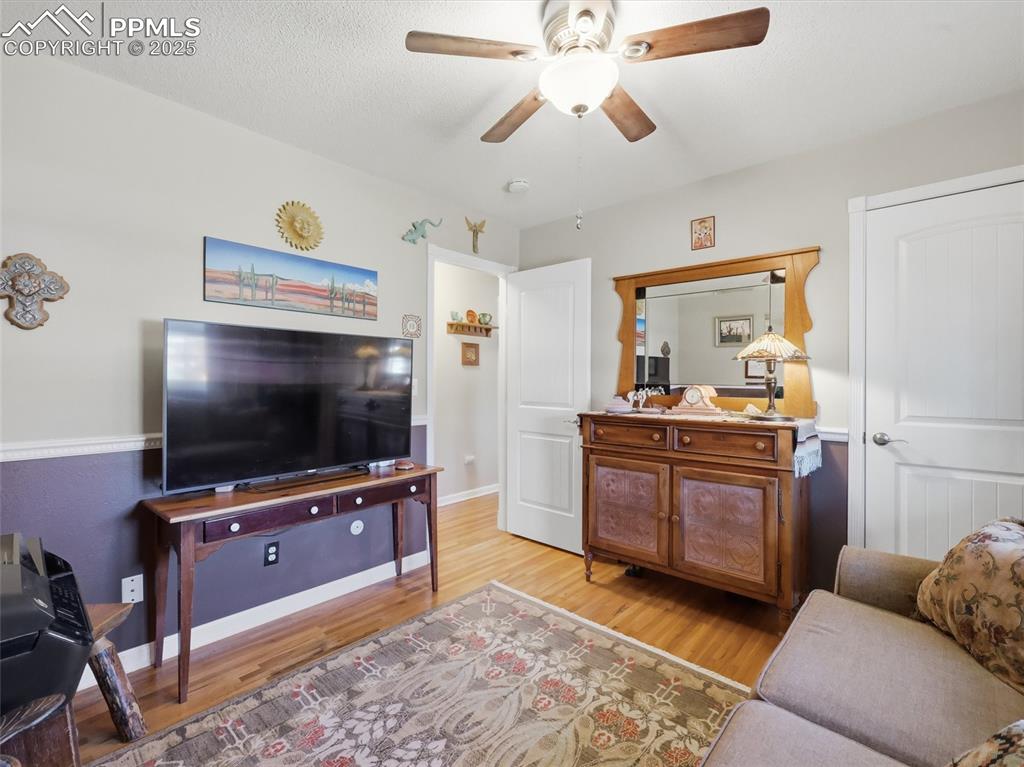 Image 24 of 47: Main floor bedroom #2 set up as a den