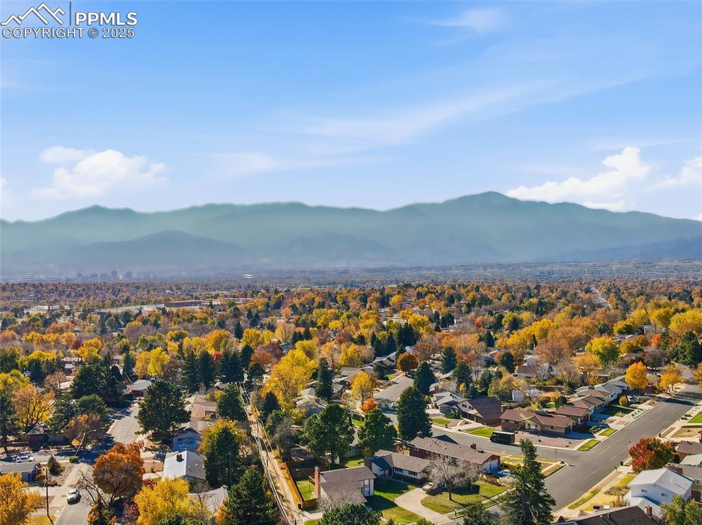 Image 45 of 47: Nicely maintained neighborhood with mature trees and mountain views