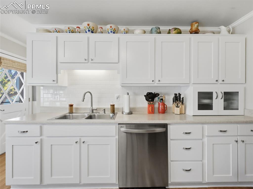 Image 5 of 47: Kitchen sink area with plenty of cabinets