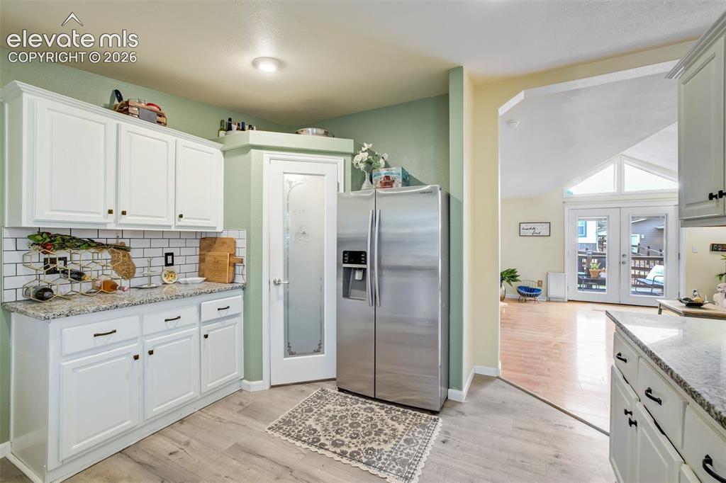 Image 15 of 50: Great room with fireplace and walk out to the backyard.