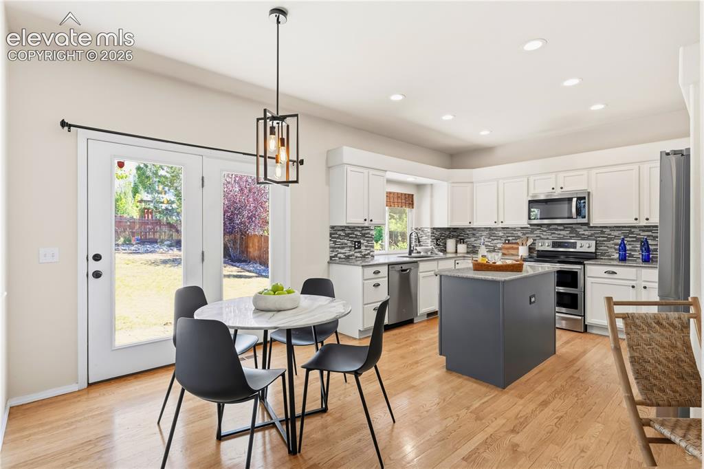 Image 11 of 50: Breakfast nook & kitchen