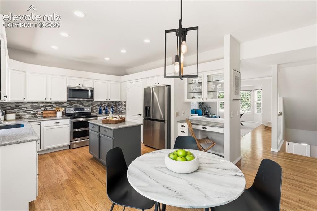 Image 12 of 50: Breakfast nook & kitchen