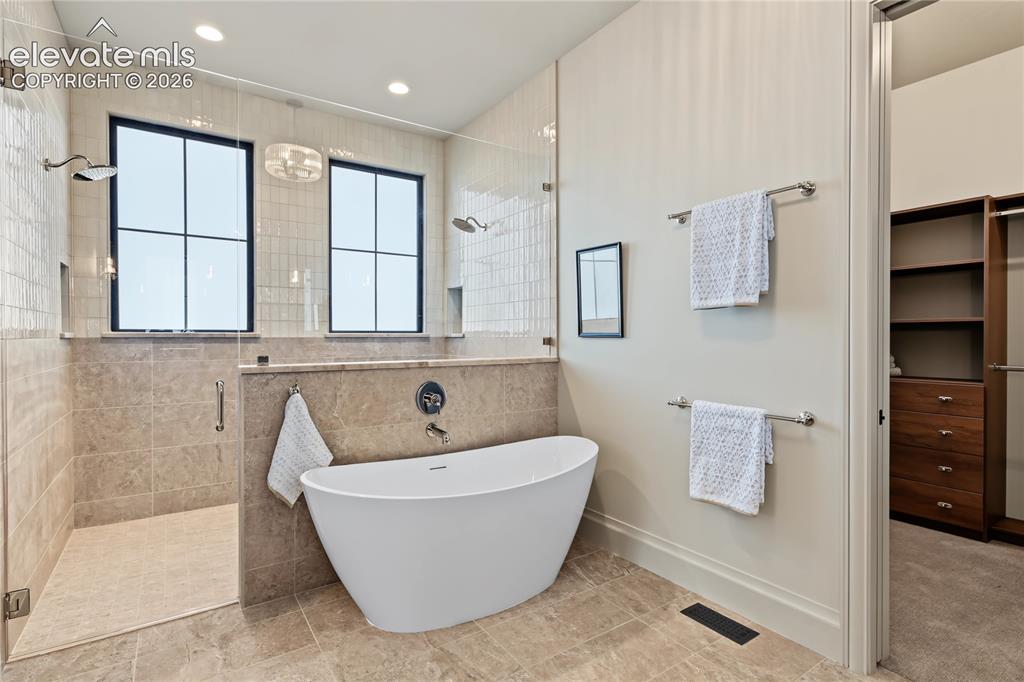 Image 15 of 50: Enjoy relaxing at the end of the day in this gorgeous bathtub