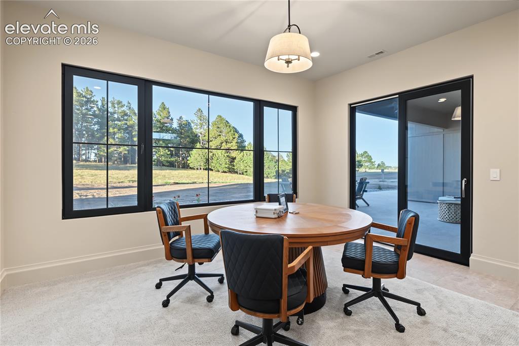 Image 33 of 50: Rec room has space for your poker table or other tables, basement