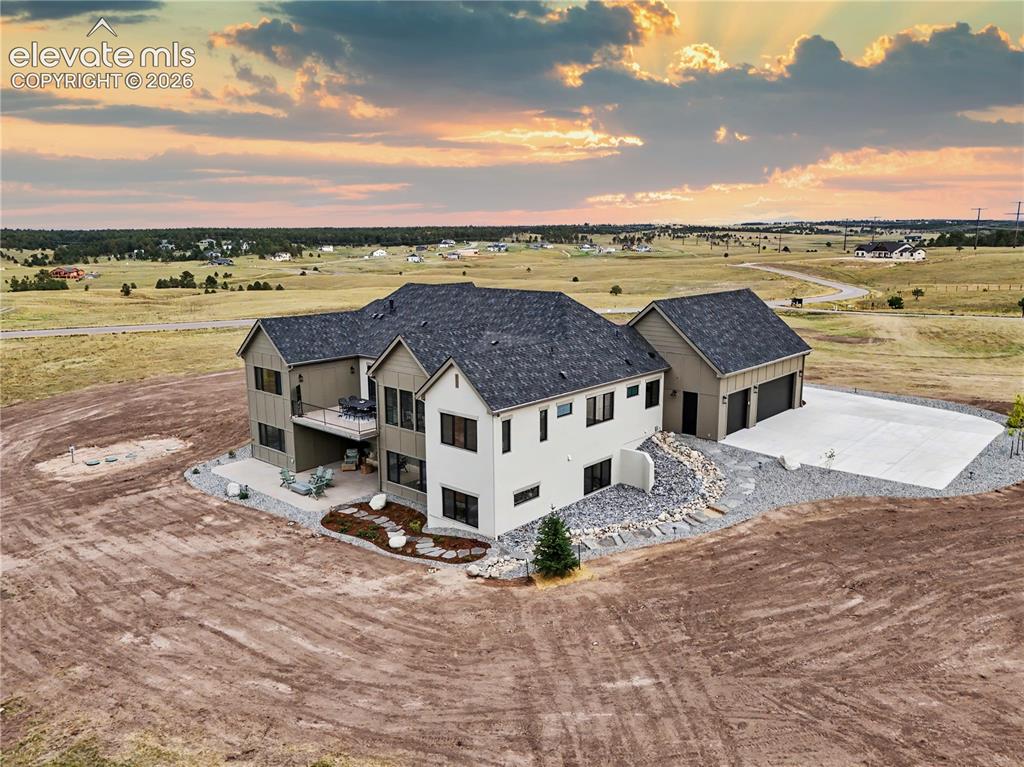 Image 46 of 50: Side view, showcasing the architectural elements of the home!
