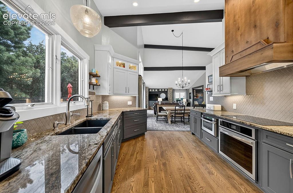 Image 10 of 50: Open floorplan- you can see all the way to the living room from the kitchen