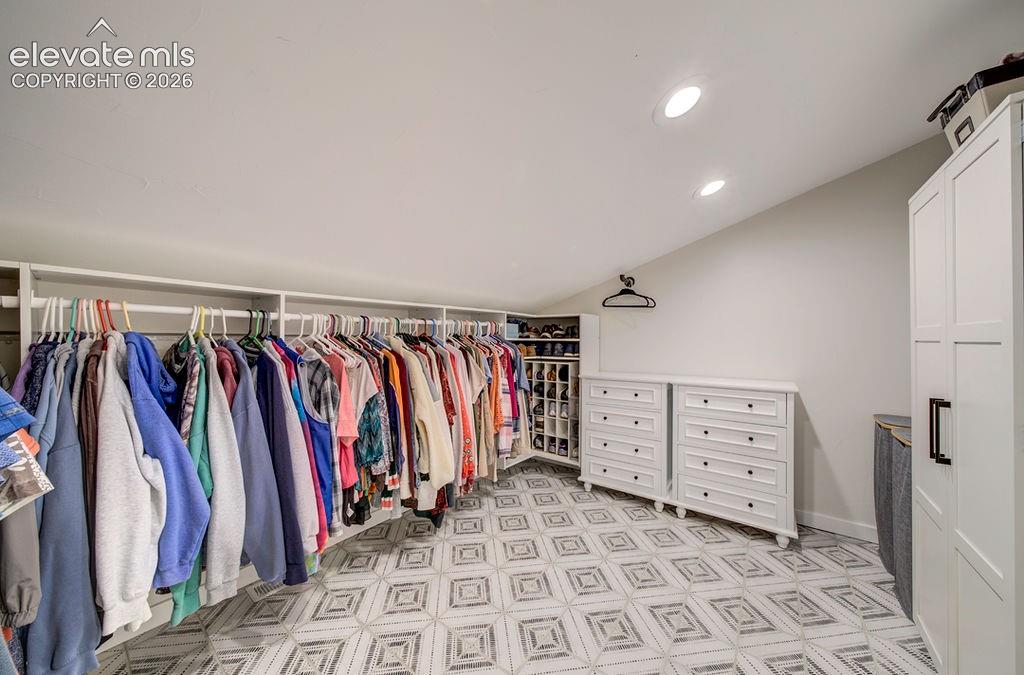 Image 26 of 50: Primary walk-in closet