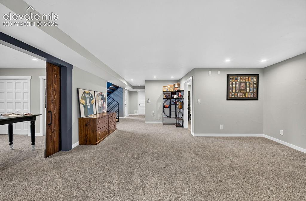 Image 33 of 50: Lower level family room
