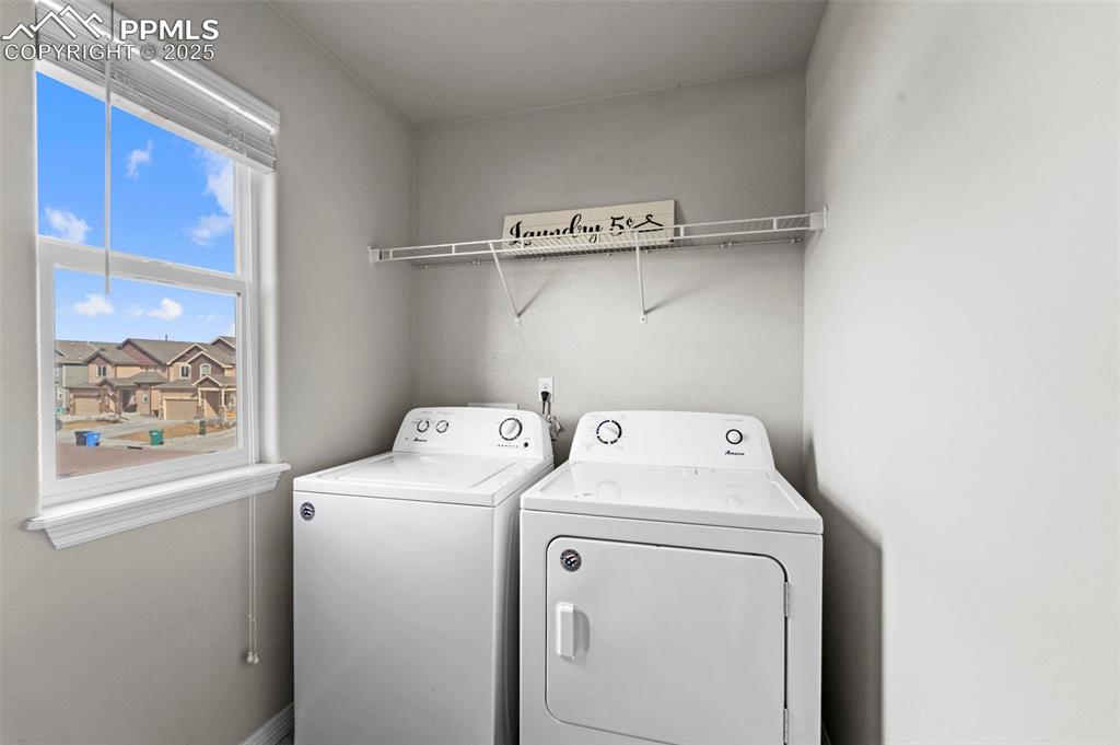Image 20 of 29: Laundry area with washing machine and dryer and laundry area