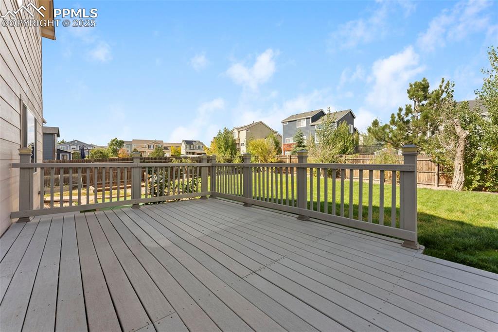 Image 32 of 50: Deck featuring a residential view and a fenced backyard