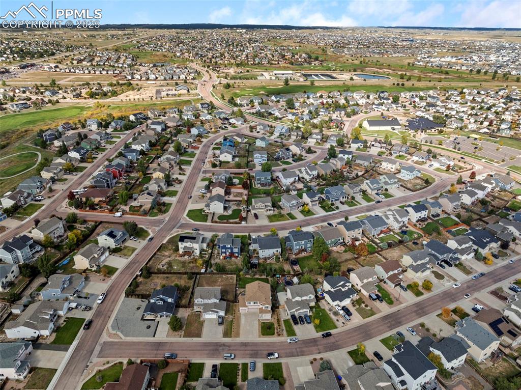 Image 47 of 50: Aerial view of property and surrounding area featuring nearby suburban area