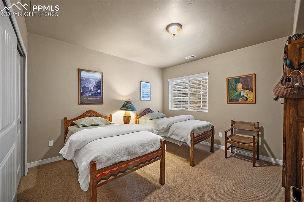 Image 30 of 39: Carpeted bedroom featuring a closet and baseboards