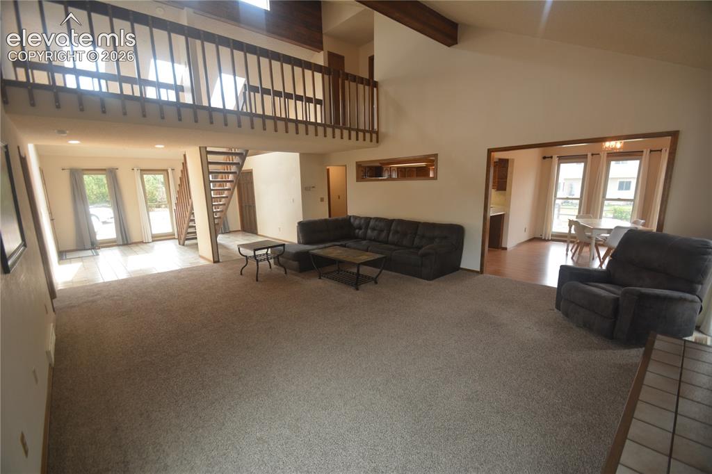 Image 12 of 45: view from living room toward entry and dining room