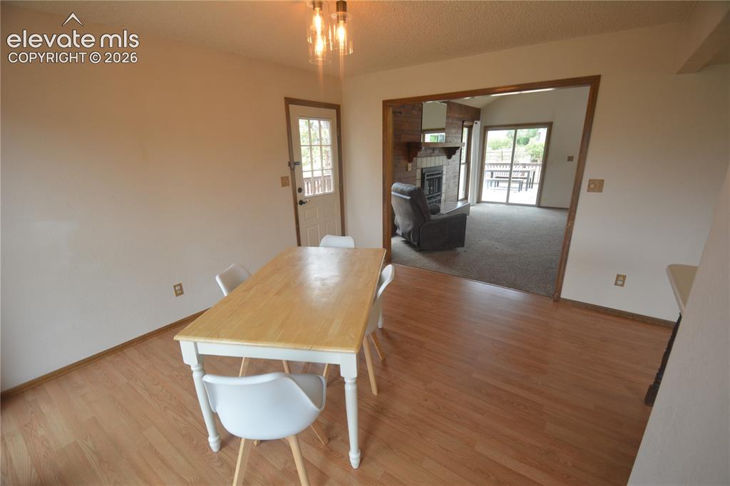 Image 16 of 45: View from dining room into living room