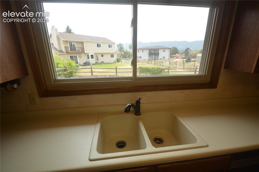 Image 22 of 45: Kitchen sink with beautiful views