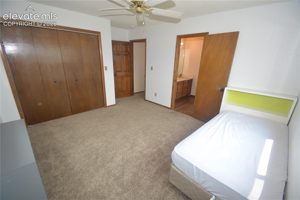Image 36 of 45: Bedroom #3 looking from inside toward entry and attached J&J bath