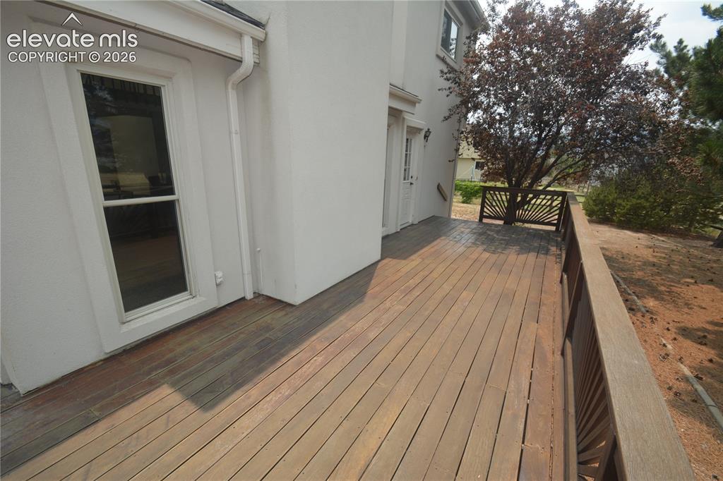Image 40 of 45: 10x23 portion of deck along back of home.