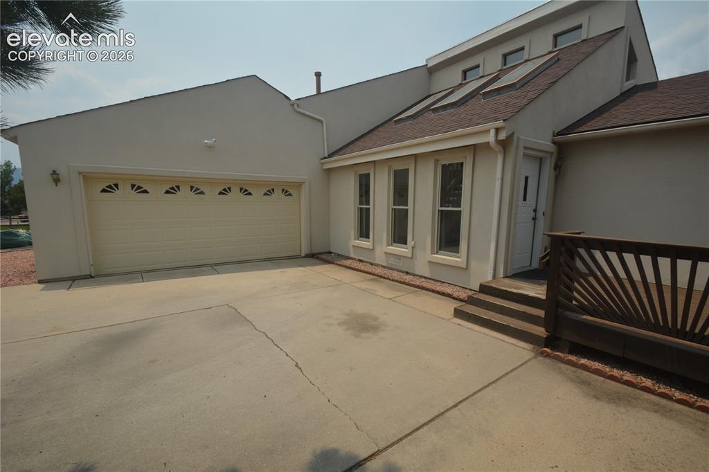 Image 5 of 45: Garage and Front Entry