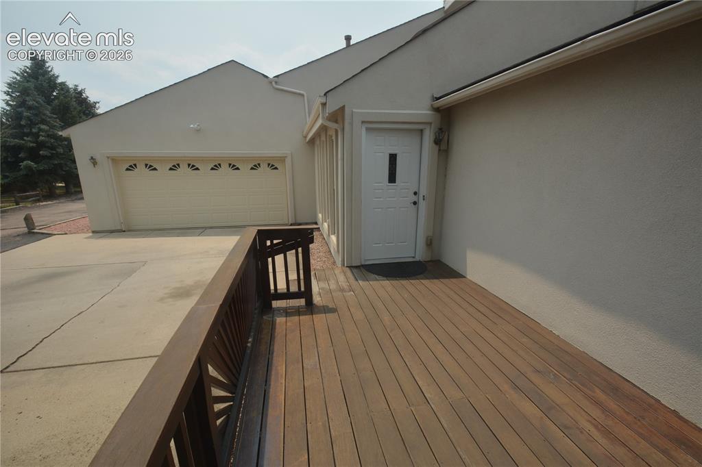 Image 7 of 45: 9x18 deck by front door