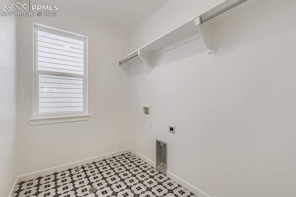 Image 26 of 28: Laundry room with electric dryer hookup and washer hookup