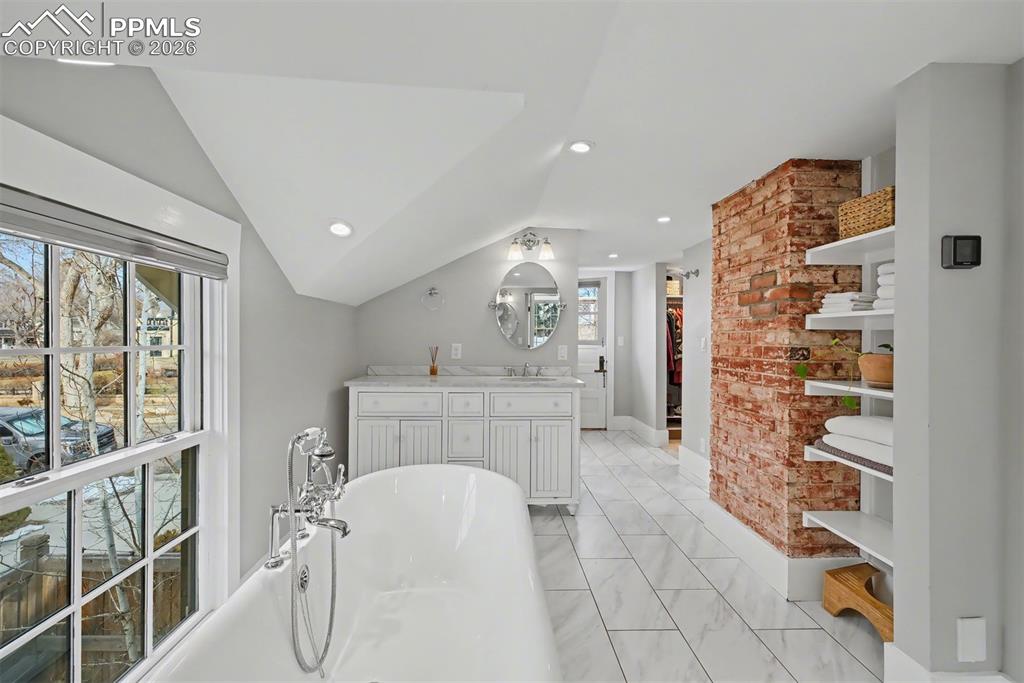 Image 26 of 43: Double vanities, 2 closets and the laundry room complete the upstairs retre