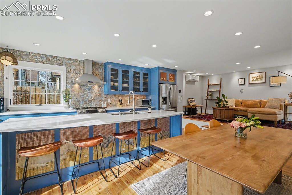 Image 4 of 43: Solid hardwood floors, custom cabinets and quartz countertops.