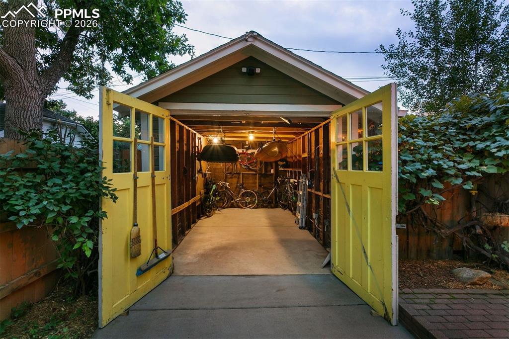 Image 40 of 43: Detached garage fits one mid sized car and all of your outdoor Colorado gea