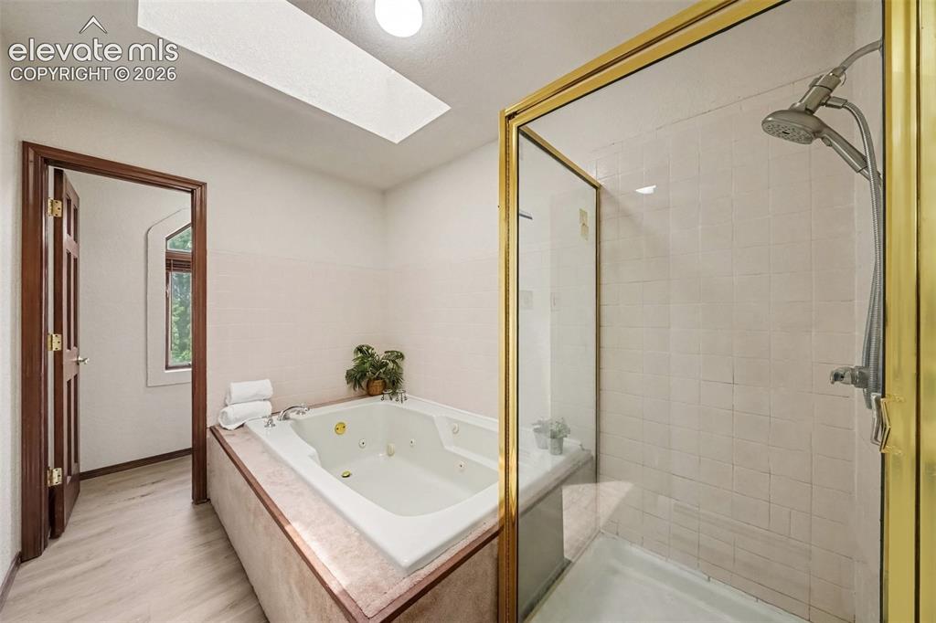 Image 21 of 44: The bright, inviting space offers comfort and a relaxing retreat.