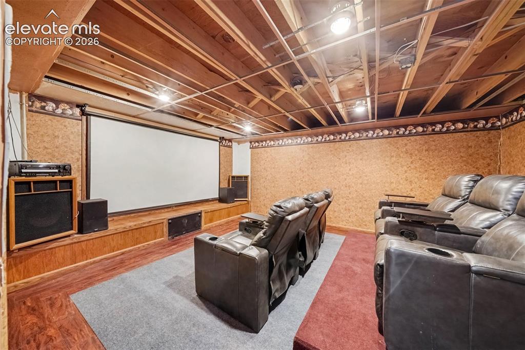 Image 27 of 44: Inviting media room featuring comfortable space for movie nights, entertain