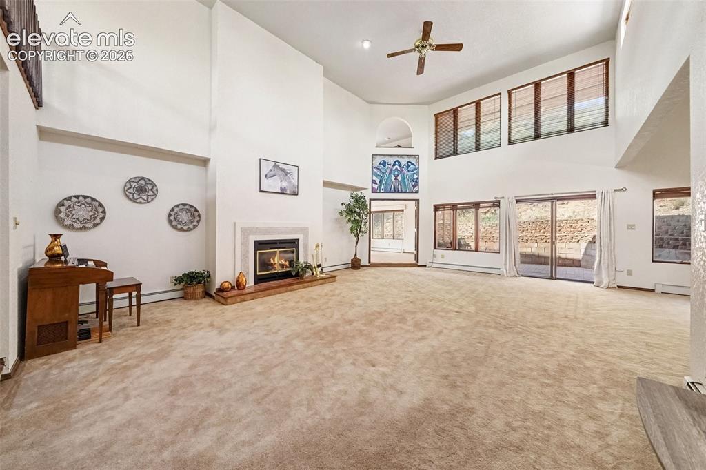 Image 5 of 44: Living room filled with natural light, creating a warm and inviting focal p