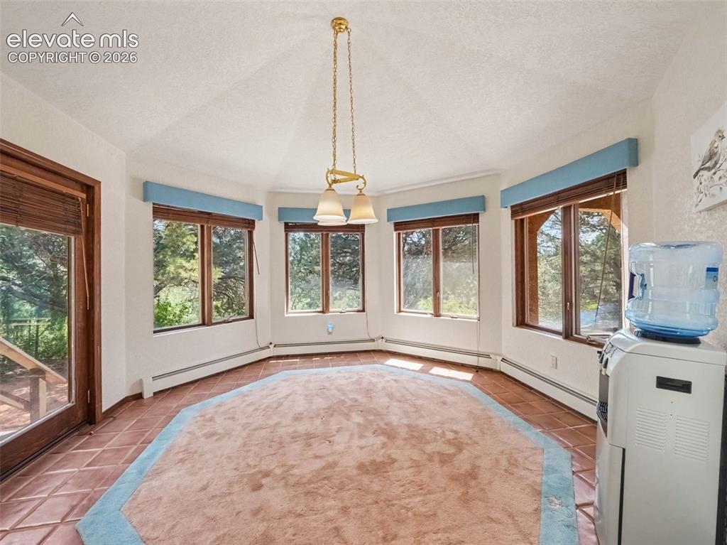 Image 8 of 44: Distinctive diamond-shaped dining area offers a unique architectural touch,