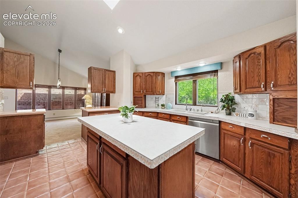 Image 9 of 44: Bright and distinctive kitchen featuring a skylight that fills the space wi