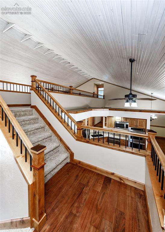 Image 15 of 50: Staircase over the kitchen to the cat walk