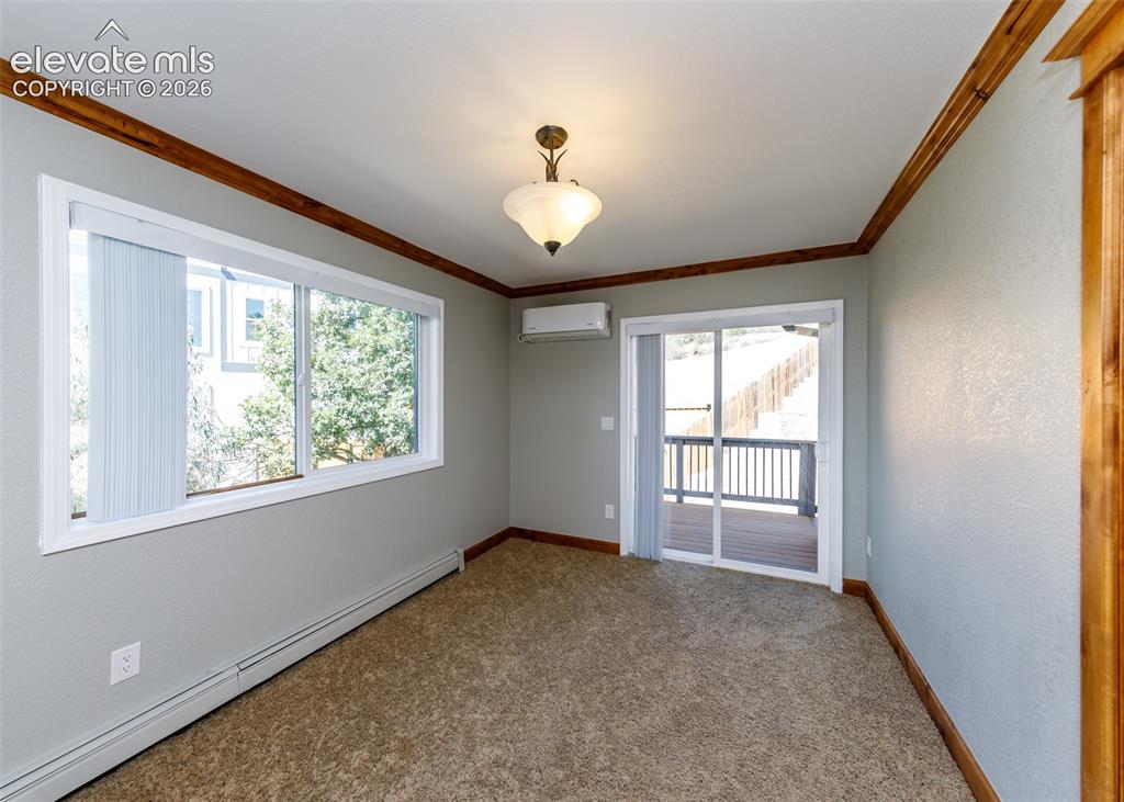 Image 19 of 50: Master bedroom living space
