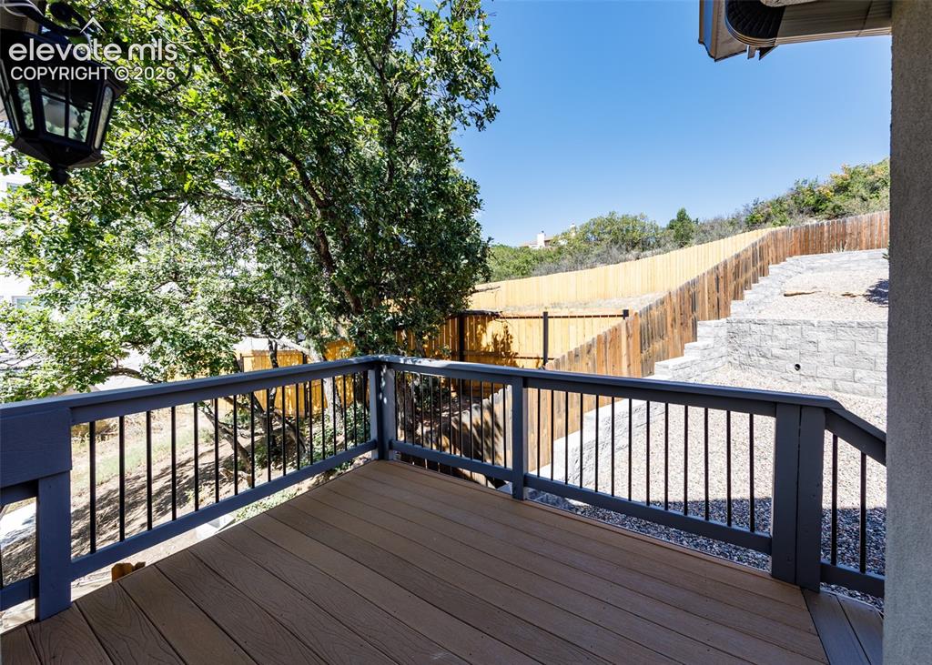 Image 20 of 50: Master bedroom private back deck