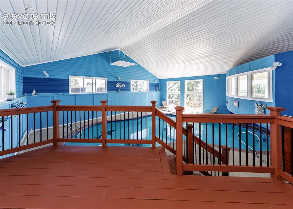 Image 35 of 50: Indoor deck to the pool area