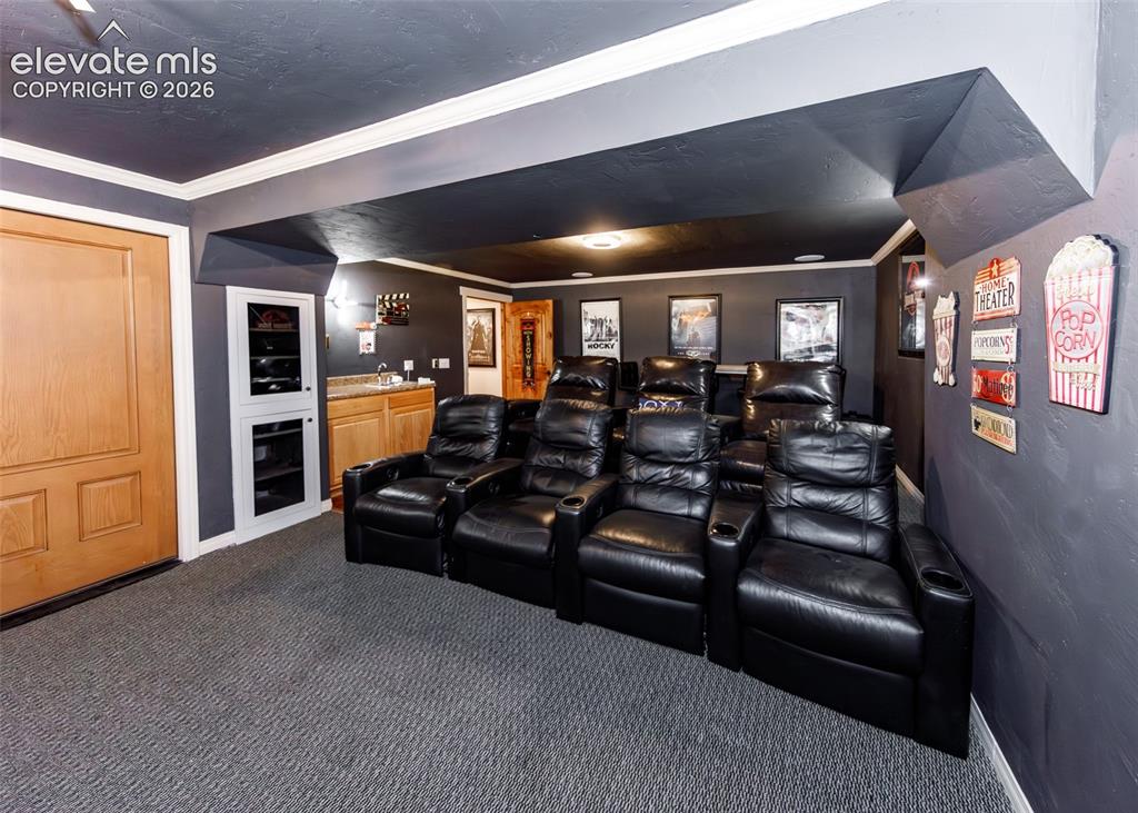 Image 38 of 50: Theater room seats 11 people comfortably.