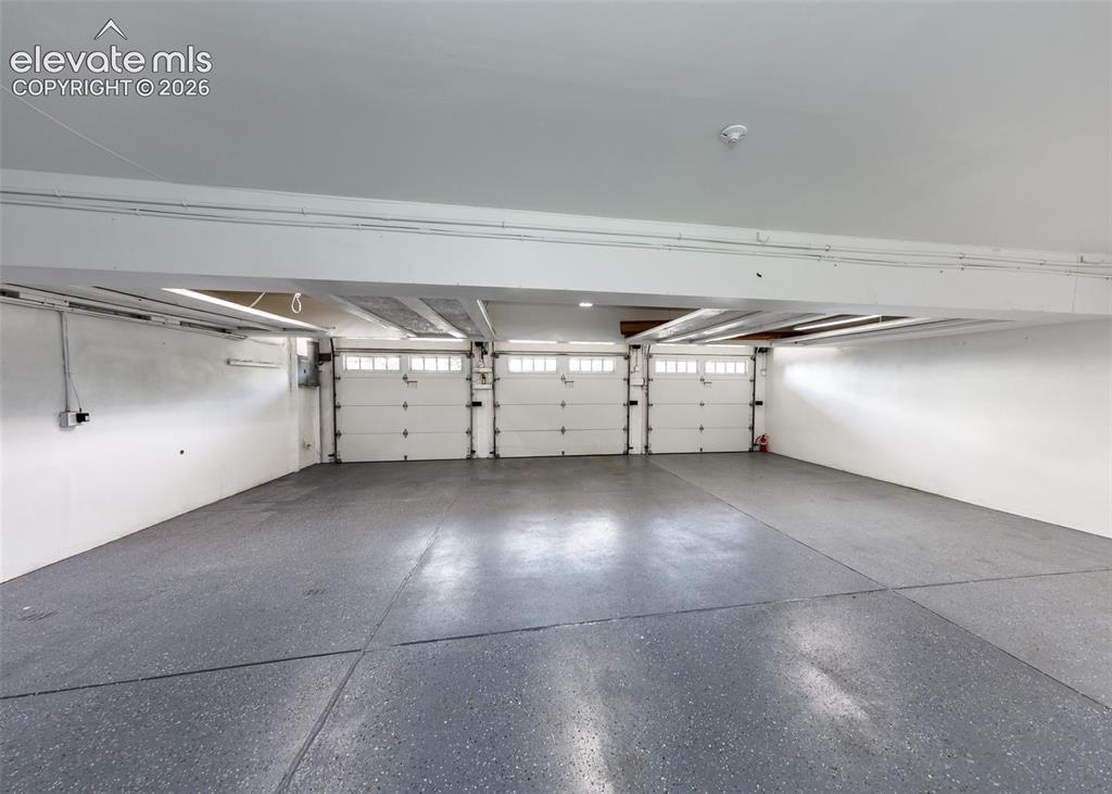 Image 42 of 50: Oversized 3 car garage with a home vacuum system