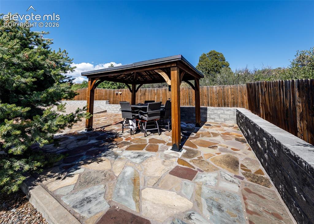 Image 50 of 50: upper patio in the back