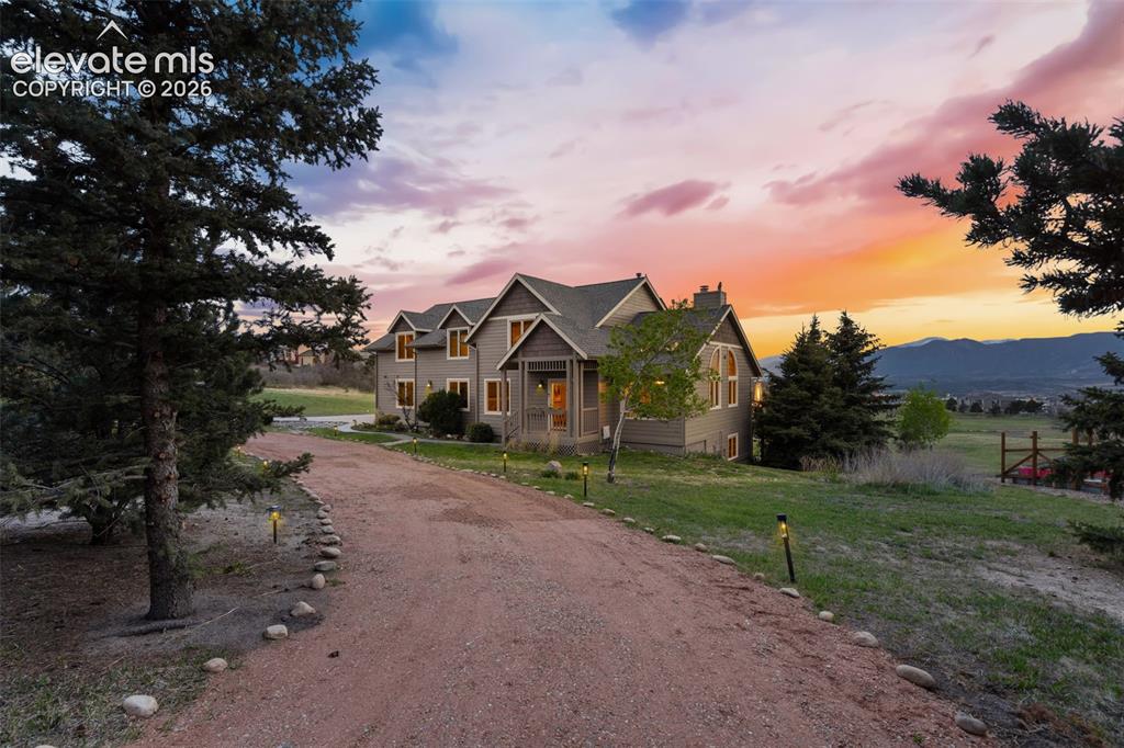 Caption: Beautifully set among mature trees on a quiet cul-de-sac, this Woodmoor home offers exceptional priv