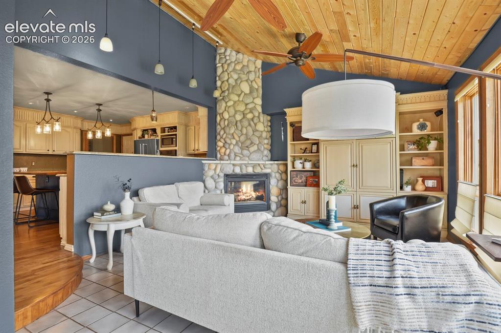 Image 10 of 41: Comfortable and inviting, the family room is centered around the fireplace 