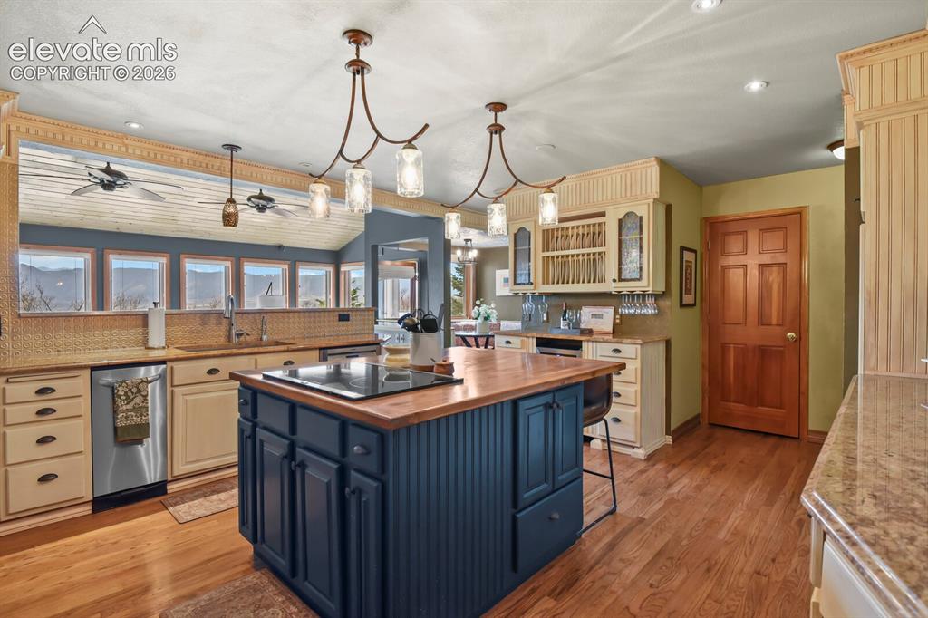 Image 12 of 41: A warm and functional kitchen designed for connection, with easy access to 