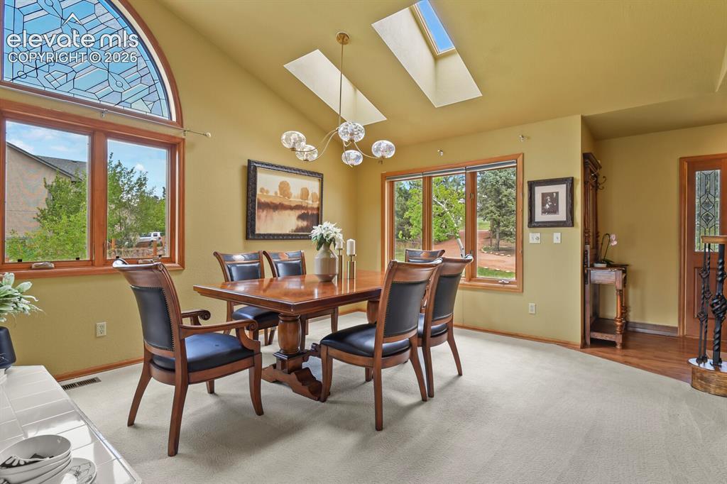 Image 14 of 41: Light-filled dining space with great flow for everyday living.