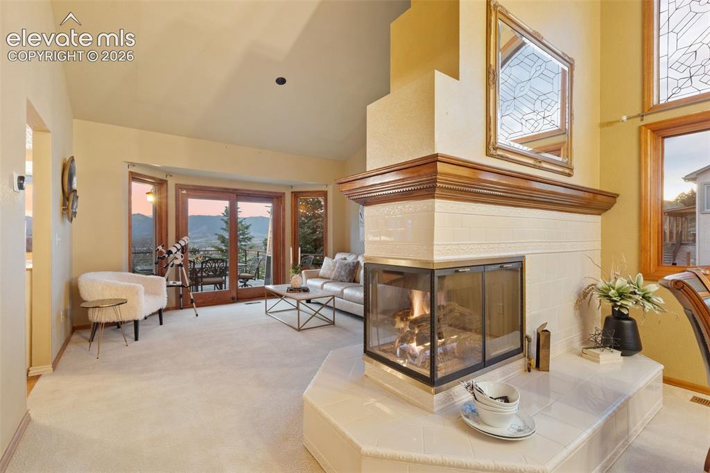 Image 16 of 41: Elegant formal living room filled with natural light, offering a refined sp