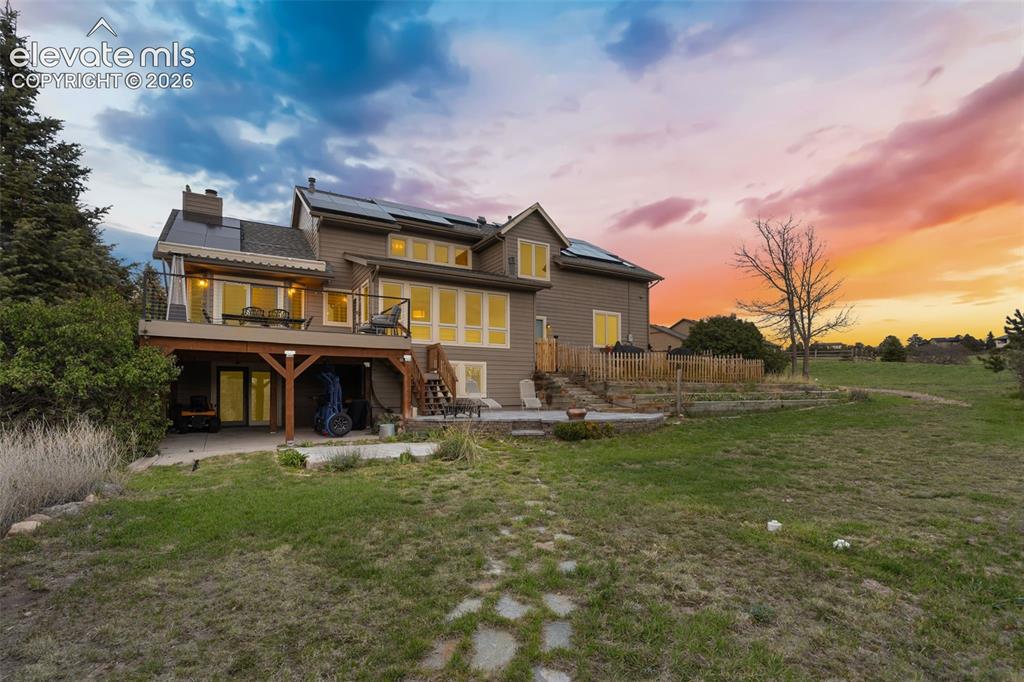 Image 2 of 41: Expansive rear exterior featuring a walkout basement, brand-new upper deck,