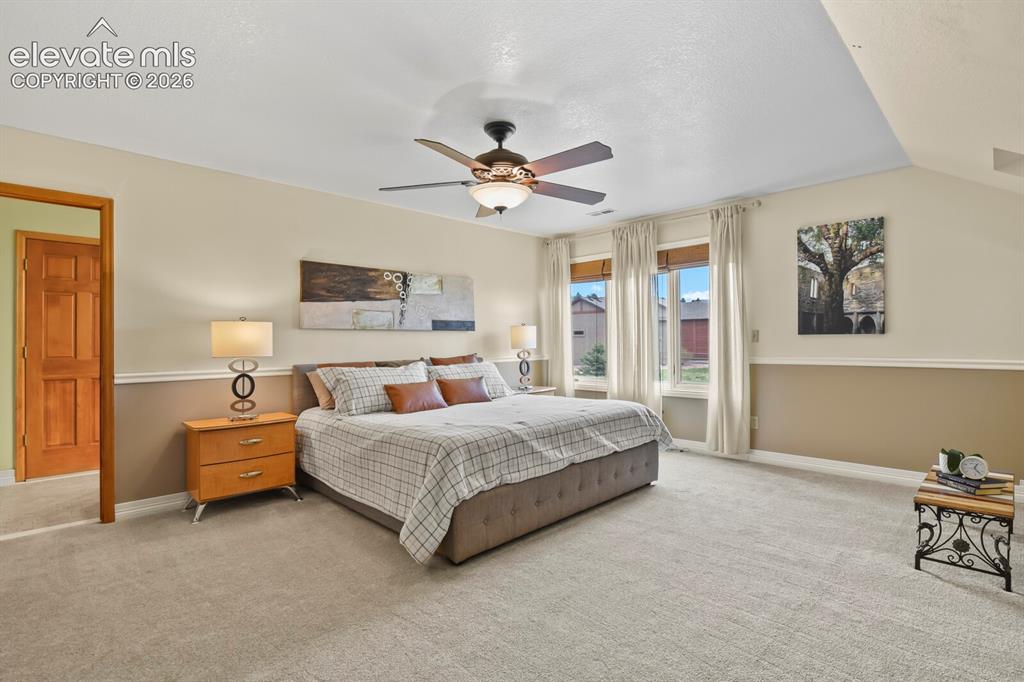 Image 20 of 41: Spacious primary suite featuring abundant natural light, generous proportio