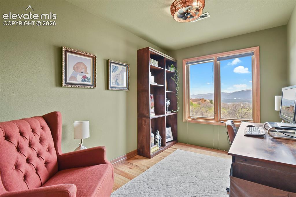Image 28 of 41: Flexible room adjacent to the primary suite—perfect as a nursery, home offi